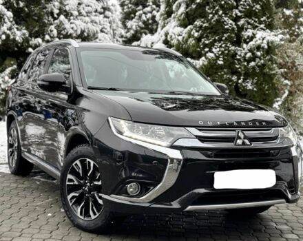 Черный Мицубиси Аутлендер, объемом двигателя 2 л и пробегом 65 тыс. км за 13200 $, фото 1 на Automoto.ua