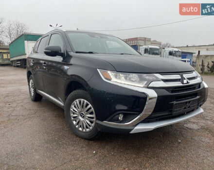 Черный Мицубиси Аутлендер, объемом двигателя 2 л и пробегом 76 тыс. км за 20800 $, фото 1 на Automoto.ua