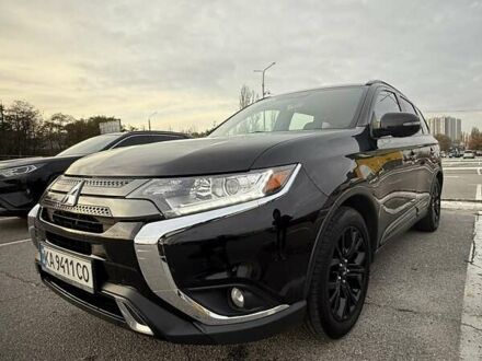 Черный Мицубиси Аутлендер, объемом двигателя 2.36 л и пробегом 153 тыс. км за 14800 $, фото 1 на Automoto.ua