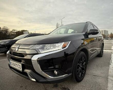 Черный Мицубиси Аутлендер, объемом двигателя 2.36 л и пробегом 153 тыс. км за 14800 $, фото 1 на Automoto.ua