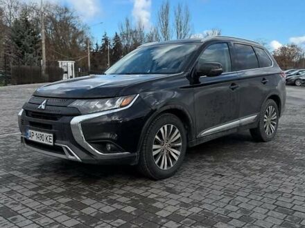 Черный Мицубиси Аутлендер, объемом двигателя 2.36 л и пробегом 91 тыс. км за 18300 $, фото 1 на Automoto.ua