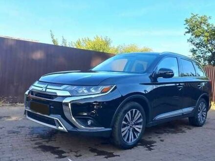 Чорний Міцубісі Аутлендер, об'ємом двигуна 2.4 л та пробігом 132 тис. км за 17600 $, фото 1 на Automoto.ua