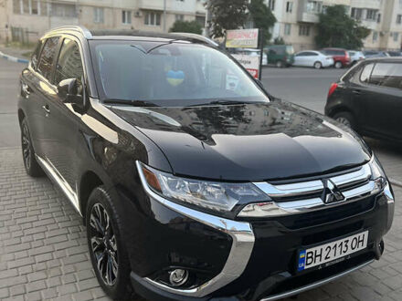 Черный Мицубиси Аутлендер, объемом двигателя 2 л и пробегом 155 тыс. км за 22500 $, фото 1 на Automoto.ua