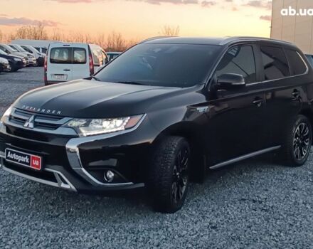 Чорний Міцубісі Аутлендер, об'ємом двигуна 2 л та пробігом 115 тис. км за 23700 $, фото 1 на Automoto.ua