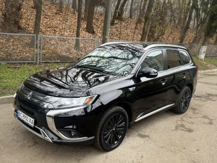 Черный Мицубиси Аутлендер, объемом двигателя 2 л и пробегом 148 тыс. км за 21800 $, фото 1 на Automoto.ua