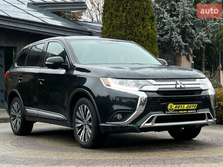 Черный Мицубиси Аутлендер, объемом двигателя 2.36 л и пробегом 144 тыс. км за 16900 $, фото 1 на Automoto.ua