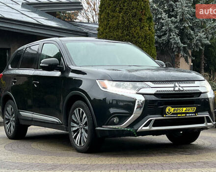 Черный Мицубиси Аутлендер, объемом двигателя 2.36 л и пробегом 144 тыс. км за 16900 $, фото 1 на Automoto.ua