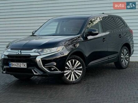 Черный Мицубиси Аутлендер, объемом двигателя 2.4 л и пробегом 53 тыс. км за 17000 $, фото 1 на Automoto.ua