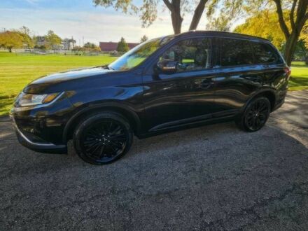 Черный Мицубиси Аутлендер, объемом двигателя 2.4 л и пробегом 47 тыс. км за 9000 $, фото 1 на Automoto.ua