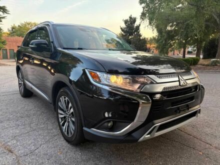 Черный Мицубиси Аутлендер, объемом двигателя 2.4 л и пробегом 49 тыс. км за 12400 $, фото 1 на Automoto.ua