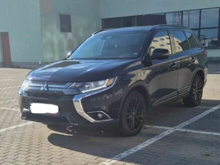 Черный Мицубиси Аутлендер, объемом двигателя 2.4 л и пробегом 38 тыс. км за 14000 $, фото 1 на Automoto.ua