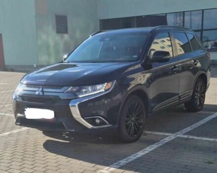 Черный Мицубиси Аутлендер, объемом двигателя 2.4 л и пробегом 38 тыс. км за 14000 $, фото 1 на Automoto.ua