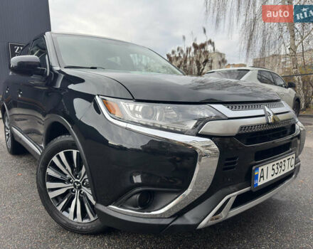 Черный Мицубиси Аутлендер, объемом двигателя 2.4 л и пробегом 44 тыс. км за 18700 $, фото 1 на Automoto.ua
