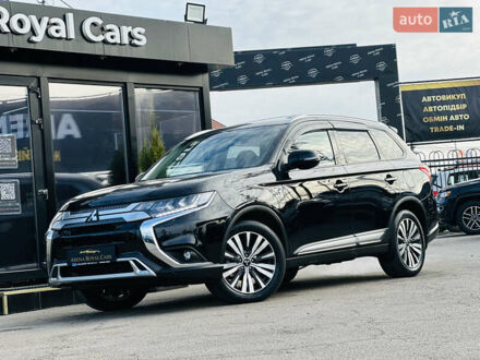 Черный Мицубиси Аутлендер, объемом двигателя 2.36 л и пробегом 64 тыс. км за 29900 $, фото 1 на Automoto.ua