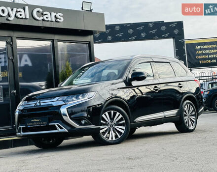 Черный Мицубиси Аутлендер, объемом двигателя 2.36 л и пробегом 64 тыс. км за 29900 $, фото 1 на Automoto.ua