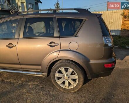 Коричневый Мицубиси Аутлендер, объемом двигателя 2.4 л и пробегом 248 тыс. км за 10000 $, фото 1 на Automoto.ua
