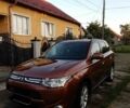 Коричневый Мицубиси Аутлендер, объемом двигателя 2.2 л и пробегом 210 тыс. км за 12500 $, фото 1 на Automoto.ua