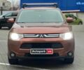 Коричневый Мицубиси Аутлендер, объемом двигателя 2.4 л и пробегом 267 тыс. км за 11990 $, фото 1 на Automoto.ua