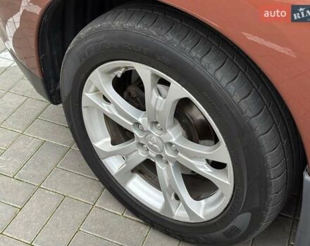 Коричневий Міцубісі Аутлендер, об'ємом двигуна 2.4 л та пробігом 267 тис. км за 11990 $, фото 7 на Automoto.ua