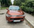 Коричневый Мицубиси Аутлендер, объемом двигателя 2.4 л и пробегом 126 тыс. км за 11500 $, фото 1 на Automoto.ua