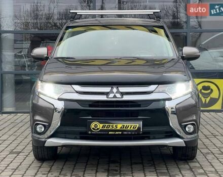 Коричневый Мицубиси Аутлендер, объемом двигателя 2.36 л и пробегом 160 тыс. км за 15000 $, фото 1 на Automoto.ua