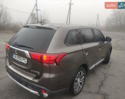 Коричневый Мицубиси Аутлендер, объемом двигателя 2.4 л и пробегом 117 тыс. км за 16500 $, фото 1 на Automoto.ua