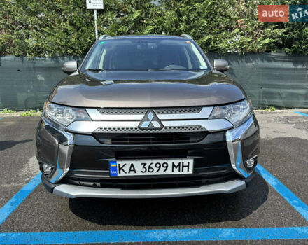 Коричневый Мицубиси Аутлендер, объемом двигателя 2.36 л и пробегом 185 тыс. км за 17670 $, фото 1 на Automoto.ua