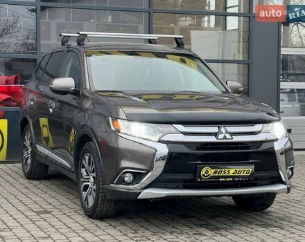 Коричневый Мицубиси Аутлендер, объемом двигателя 2.36 л и пробегом 160 тыс. км за 15000 $, фото 1 на Automoto.ua