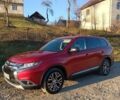 Красный Мицубиси Аутлендер, объемом двигателя 2.4 л и пробегом 118 тыс. км за 13300 $, фото 1 на Automoto.ua
