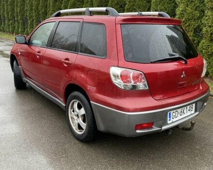Красный Мицубиси Аутлендер, объемом двигателя 2.4 л и пробегом 293 тыс. км за 3595 $, фото 1 на Automoto.ua
