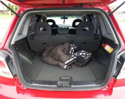 Красный Мицубиси Аутлендер, объемом двигателя 2 л и пробегом 217 тыс. км за 6250 $, фото 5 на Automoto.ua