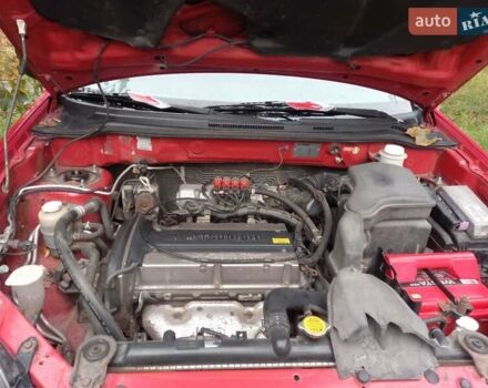 Красный Мицубиси Аутлендер, объемом двигателя 2 л и пробегом 217 тыс. км за 6250 $, фото 6 на Automoto.ua