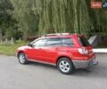 Красный Мицубиси Аутлендер, объемом двигателя 2 л и пробегом 217 тыс. км за 6250 $, фото 7 на Automoto.ua