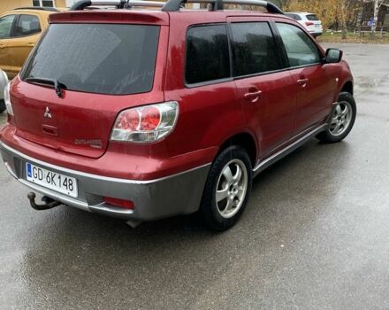 Красный Мицубиси Аутлендер, объемом двигателя 2.4 л и пробегом 293 тыс. км за 3408 $, фото 2 на Automoto.ua