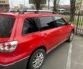 Красный Мицубиси Аутлендер, объемом двигателя 2 л и пробегом 344 тыс. км за 4300 $, фото 2 на Automoto.ua