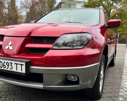 Красный Мицубиси Аутлендер, объемом двигателя 2.4 л и пробегом 174 тыс. км за 6900 $, фото 3 на Automoto.ua