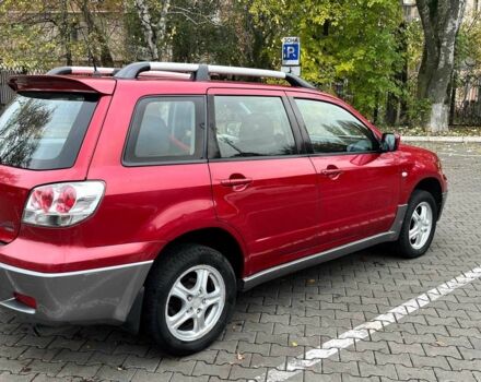 Красный Мицубиси Аутлендер, объемом двигателя 2.4 л и пробегом 174 тыс. км за 6900 $, фото 7 на Automoto.ua