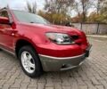 Красный Мицубиси Аутлендер, объемом двигателя 2.4 л и пробегом 174 тыс. км за 6900 $, фото 1 на Automoto.ua