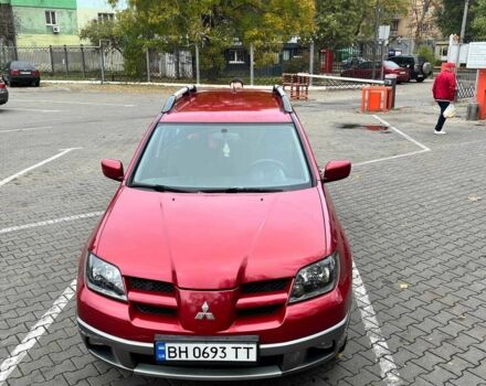 Красный Мицубиси Аутлендер, объемом двигателя 2.4 л и пробегом 174 тыс. км за 6900 $, фото 4 на Automoto.ua