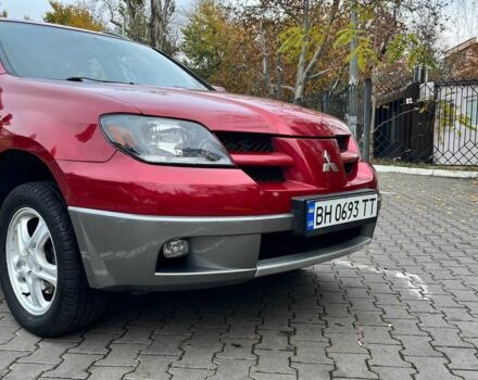 Красный Мицубиси Аутлендер, объемом двигателя 2.4 л и пробегом 174 тыс. км за 6900 $, фото 2 на Automoto.ua