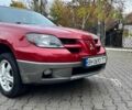 Красный Мицубиси Аутлендер, объемом двигателя 2.4 л и пробегом 174 тыс. км за 6900 $, фото 2 на Automoto.ua