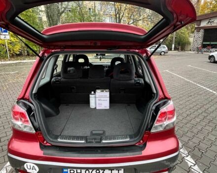 Красный Мицубиси Аутлендер, объемом двигателя 2.4 л и пробегом 174 тыс. км за 6900 $, фото 9 на Automoto.ua