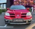 Червоний Міцубісі Аутлендер, об'ємом двигуна 2.38 л та пробігом 195 тис. км за 7990 $, фото 1 на Automoto.ua