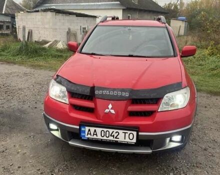 Червоний Міцубісі Аутлендер, об'ємом двигуна 2.4 л та пробігом 373 тис. км за 5270 $, фото 7 на Automoto.ua