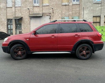Красный Мицубиси Аутлендер, объемом двигателя 2.4 л и пробегом 224 тыс. км за 5600 $, фото 3 на Automoto.ua