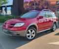Червоний Міцубісі Аутлендер, об'ємом двигуна 2.38 л та пробігом 195 тис. км за 7990 $, фото 2 на Automoto.ua