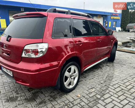 Червоний Міцубісі Аутлендер, об'ємом двигуна 2.4 л та пробігом 187 тис. км за 5600 $, фото 2 на Automoto.ua
