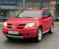 Червоний Міцубісі Аутлендер, об'ємом двигуна 2.4 л та пробігом 308 тис. км за 5990 $, фото 3 на Automoto.ua