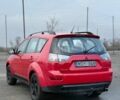 Красный Мицубиси Аутлендер, объемом двигателя 2 л и пробегом 290 тыс. км за 5200 $, фото 3 на Automoto.ua
