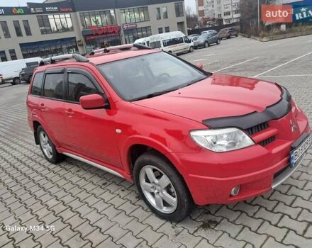 Красный Мицубиси Аутлендер, объемом двигателя 2.4 л и пробегом 269 тыс. км за 5700 $, фото 3 на Automoto.ua